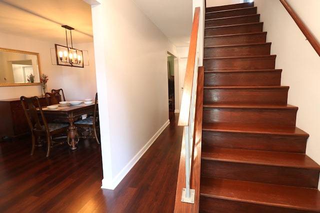 2210 Sandburg Dr, Aurora, IL 60506 - stairway with wood finished floors, a chandelier, and baseboards