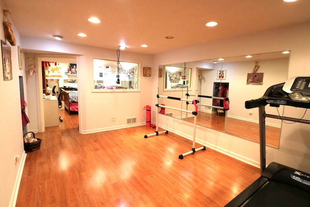 2210 Sandburg Dr, Aurora, IL 60506 - workout room featuring recessed lighting, wood finished floors, and baseboards