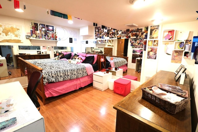 2210 Sandburg Dr, Aurora, IL 60506 - bedroom with wood finished floors and a dry bar
