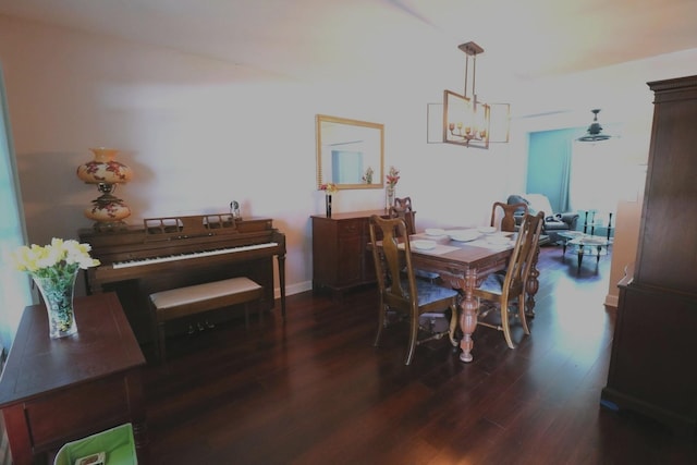 2210 Sandburg Dr, Aurora, IL 60506 - dining room with a chandelier, dark wood finished floors, and baseboards