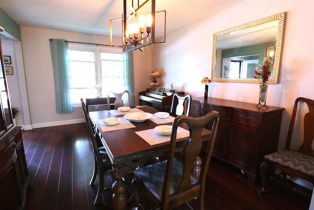 2210 Sandburg Dr, Aurora, IL 60506 - dining area with a chandelier, dark wood-style flooring, and baseboards