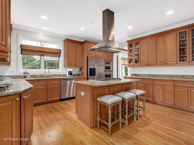 220 Kings Ct, La Grange Park, IL 60526 - kitchen with appliances with stainless steel finishes, island exhaust hood, a sink, crown molding, and a center island