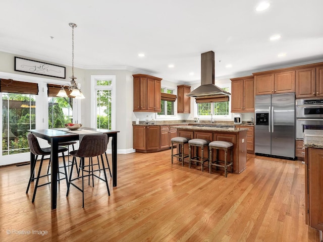 220 Kings Ct, La Grange Park, IL 60526 - kitchen with stainless steel appliances, island exhaust hood, a center island, brown cabinetry, and crown molding
