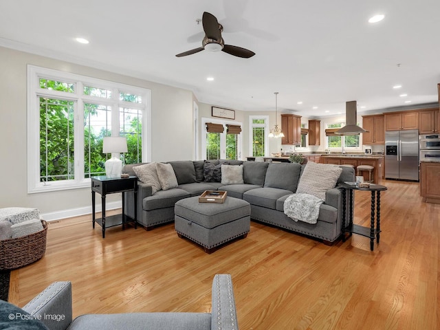 220 Kings Ct, La Grange Park, IL 60526 - living area with healthy amount of natural light, light wood-type flooring, ceiling fan, recessed lighting, and baseboards