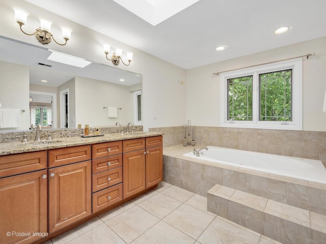 220 Kings Ct, La Grange Park, IL 60526 - bathroom with a garden tub, tile patterned flooring, double vanity, a skylight, and recessed lighting