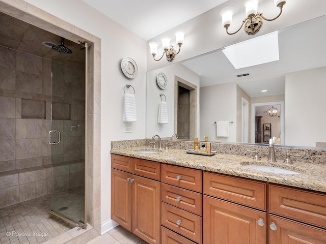 220 Kings Ct, La Grange Park, IL 60526 - bathroom with a skylight, a shower stall, double vanity, and tile patterned floors