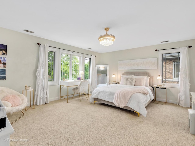 220 Kings Ct, La Grange Park, IL 60526 - bedroom with carpet flooring, baseboards, and a chandelier