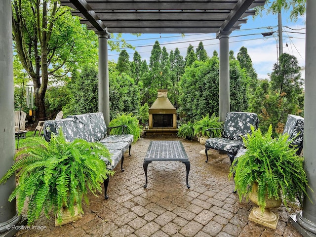 220 Kings Ct, La Grange Park, IL 60526 - view of patio featuring an outdoor stone fireplace, a pergola, and view of wooded area