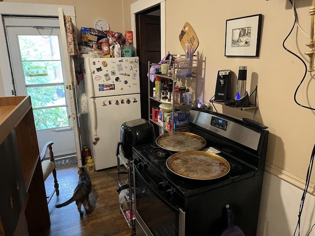 718 Plainfield Rd, Joliet, IL 60435 - kitchen with electric stove, freestanding refrigerator, and wood finished floors