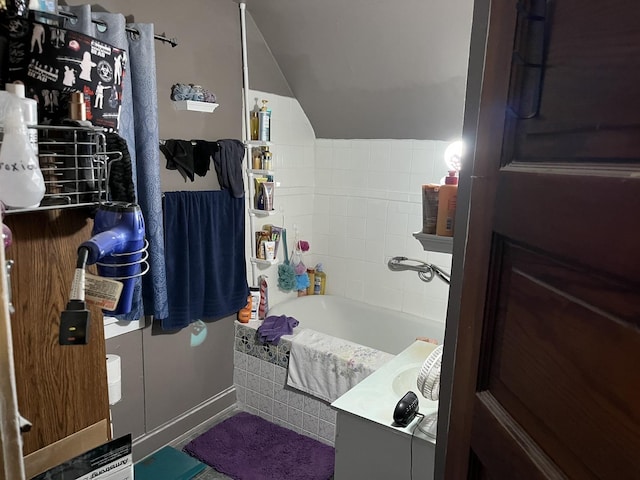 718 Plainfield Rd, Joliet, IL 60435 - full bathroom with lofted ceiling, a tub to relax in, and vanity
