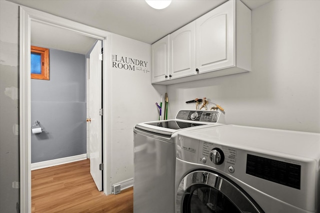 917 N Coolidge Ave, Palatine, IL 60067 - washroom featuring cabinet space, independent washer and dryer, light wood-style flooring, and baseboards