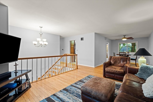 917 N Coolidge Ave, Palatine, IL 60067 - living room featuring a chandelier, ceiling fan, wood finished floors, and baseboards
