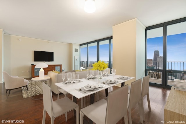 225 N Columbus Dr Unit 6204, Chicago, IL 60601 - dining area with a wall of windows, dark wood-style floors, and baseboards