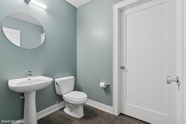225 N Columbus Dr Unit 6204, Chicago, IL 60601 - half bathroom featuring baseboards, toilet, and a sink
