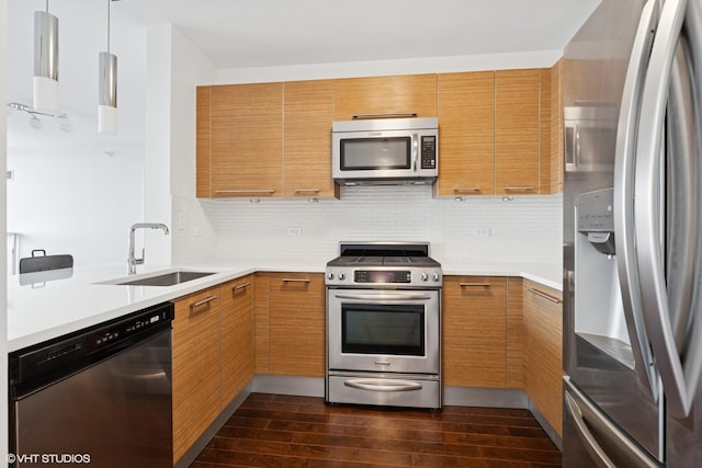 225 N Columbus Dr Unit 6204, Chicago, IL 60601 - kitchen featuring appliances with stainless steel finishes, a sink, dark wood-style floors, light countertops, and decorative backsplash