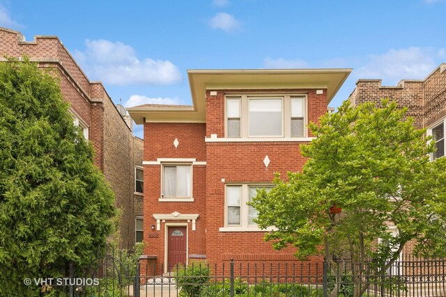 4842 N California Ave, Chicago, IL 60625 - view of front of house with brick siding and a fenced front yard