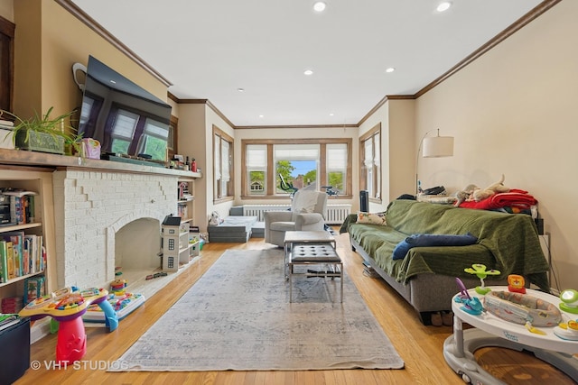 4842 N California Ave, Chicago, IL 60625 - living room with ornamental molding, radiator, radiator heating unit, wood finished floors, and recessed lighting