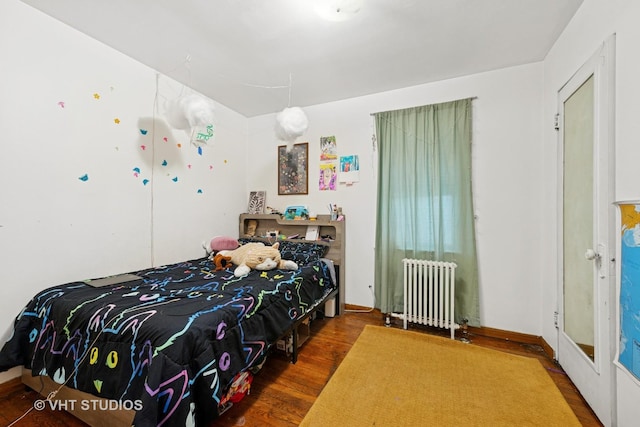 4842 N California Ave, Chicago, IL 60625 - bedroom featuring radiator and wood finished floors