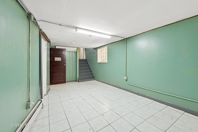 4842 N California Ave, Chicago, IL 60625 - below grade area with stairway and a baseboard heating unit