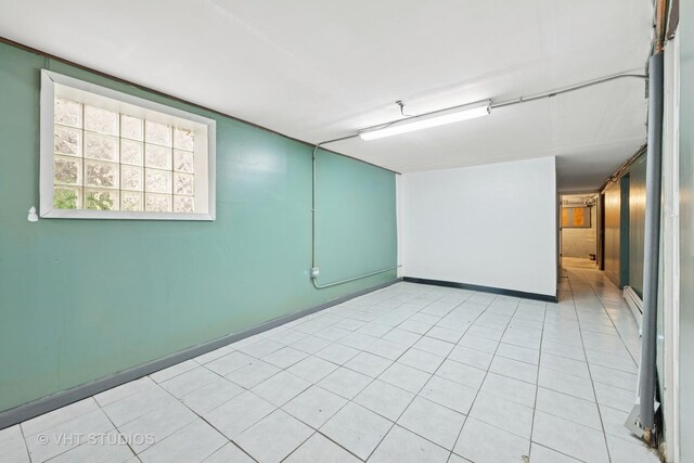 4842 N California Ave, Chicago, IL 60625 - unfurnished room with baseboards and light tile patterned floors