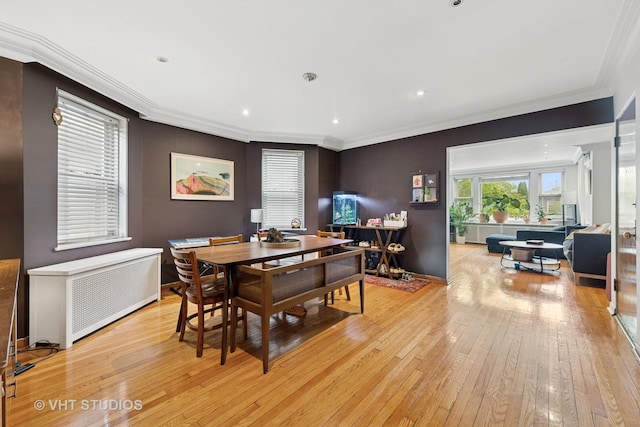 4842 N California Ave, Chicago, IL 60625 - dining room featuring light wood finished floors, radiator, crown molding, recessed lighting, and baseboards