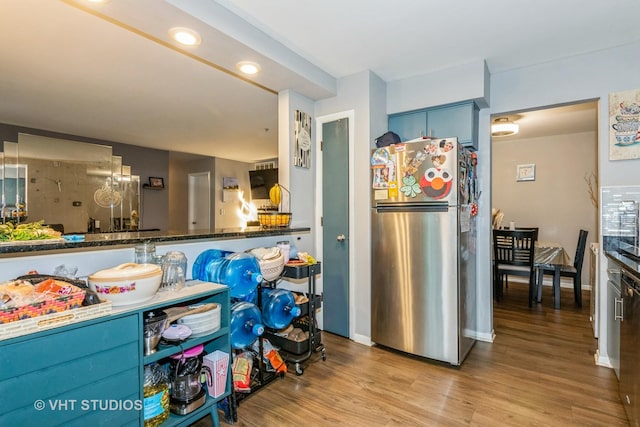 305 Walters Ln Unit 1B, Itasca, IL 60143 - kitchen with freestanding refrigerator, wood finished floors, baseboards, and recessed lighting