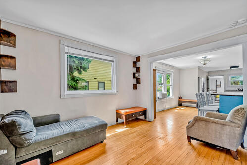 1144 N Austin Blvd, Oak Park, IL 60302 - living room with light wood-style flooring and ornamental molding