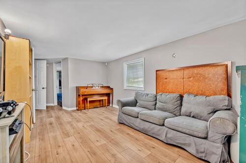 1144 N Austin Blvd, Oak Park, IL 60302 - living room with light wood-style floors and baseboards