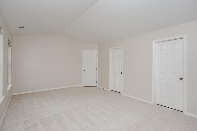 1402 Orange Ct Unit D, Mount Prospect, IL 60056 - unfurnished bedroom with vaulted ceiling, carpet, and baseboards