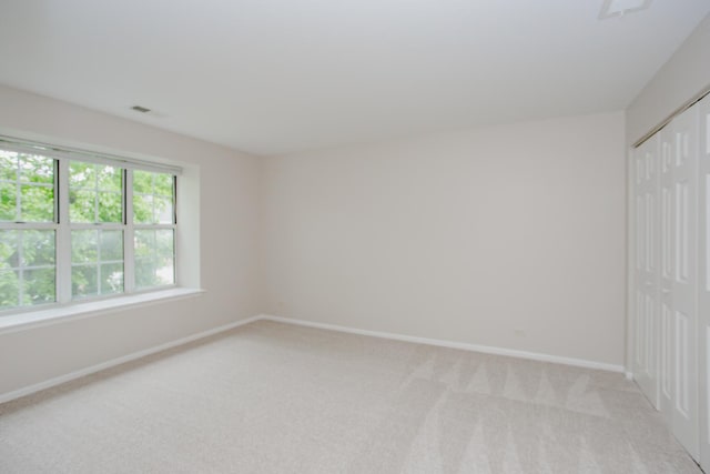 1402 Orange Ct Unit D, Mount Prospect, IL 60056 - unfurnished bedroom with a closet, light colored carpet, and baseboards
