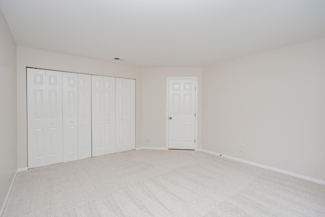 1402 Orange Ct Unit D, Mount Prospect, IL 60056 - unfurnished bedroom featuring baseboards, carpet floors, and a closet