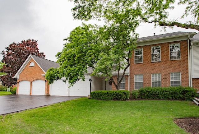 1402 Orange Ct Unit D, Mount Prospect, IL 60056 - view of front facade featuring brick siding, driveway, a front yard, and a garage