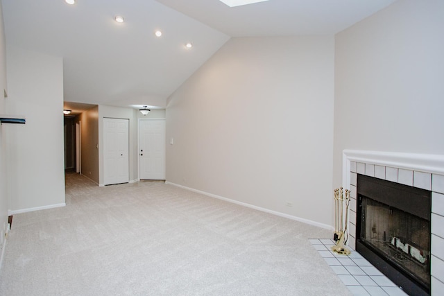 1402 Orange Ct Unit D, Mount Prospect, IL 60056 - unfurnished living room with a tile fireplace, light carpet, baseboards, recessed lighting, and lofted ceiling