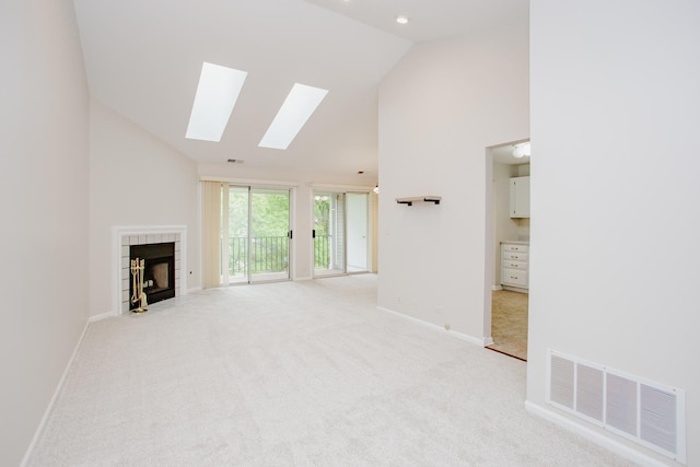 1402 Orange Ct Unit D, Mount Prospect, IL 60056 - unfurnished living room featuring high vaulted ceiling, a skylight, baseboards, and light carpet