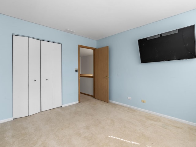 1874 Wisteria Dr, Aurora, IL 60503 - unfurnished bedroom with carpet flooring, baseboards, and a closet