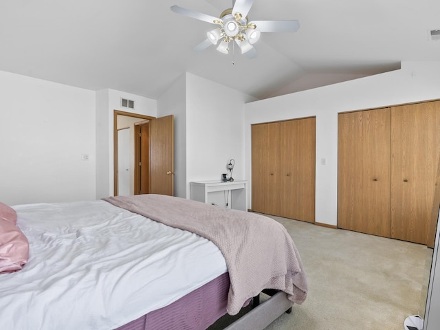 1874 Wisteria Dr, Aurora, IL 60503 - bedroom featuring vaulted ceiling, multiple closets, light carpet, and ceiling fan