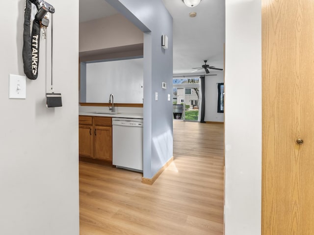 1874 Wisteria Dr, Aurora, IL 60503 - corridor featuring a sink and light wood-style flooring