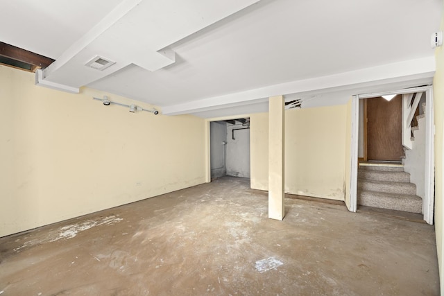 finished basement featuring stairs