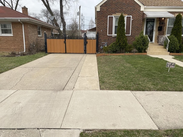 3846 Brummel St, Skokie, IL 60076 - bungalow-style home with a gate, brick siding, and a front lawn