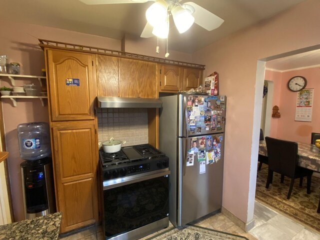 3846 Brummel St, Skokie, IL 60076 - kitchen featuring freestanding refrigerator, gas range, ceiling fan, exhaust hood, and backsplash