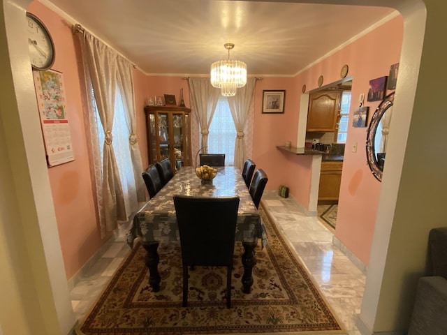 3846 Brummel St, Skokie, IL 60076 - dining area with a chandelier, plenty of natural light, ornamental molding, and baseboards