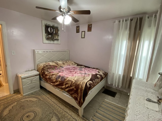 3846 Brummel St, Skokie, IL 60076 - bedroom with tile patterned floors and a ceiling fan