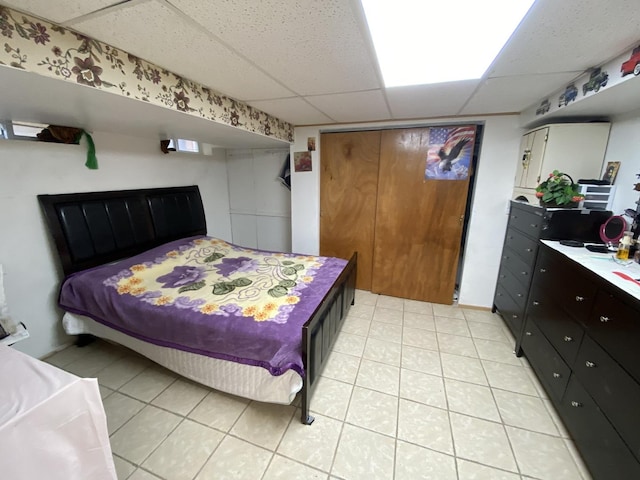 3846 Brummel St, Skokie, IL 60076 - bedroom with a paneled ceiling and light tile patterned floors