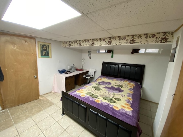3846 Brummel St, Skokie, IL 60076 - bedroom featuring light tile patterned floors and a paneled ceiling