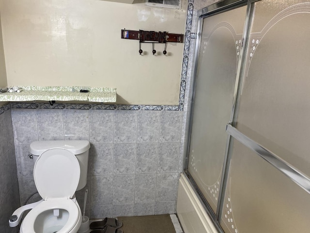 3846 Brummel St, Skokie, IL 60076 - full bath with tile walls, toilet, bath / shower combo with glass door, and wainscoting