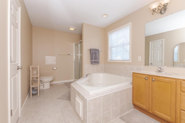 bathroom with tile patterned floors, toilet, a garden tub, vanity, and a shower stall