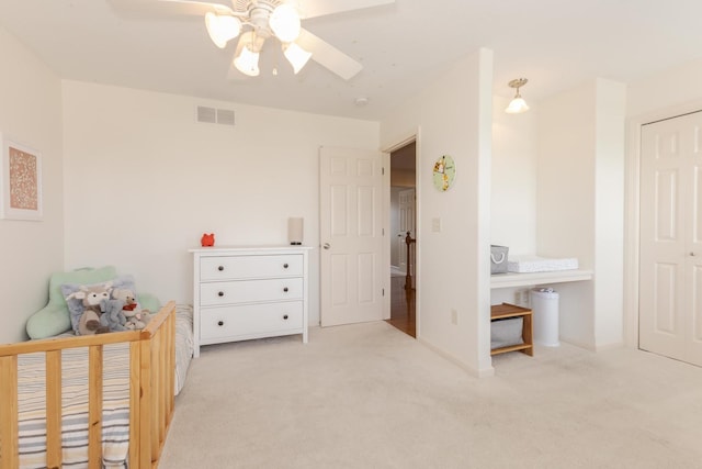 carpeted bedroom featuring a ceiling fan