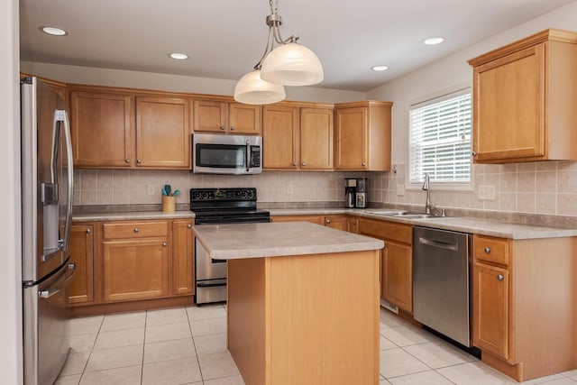 kitchen with appliances with stainless steel finishes, a sink, light countertops, backsplash, and recessed lighting