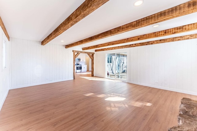 617 Tanglewood Dr, Streamwood, IL 60107 - unfurnished living room with light wood-style floors, baseboards, beamed ceiling, and wooden walls
