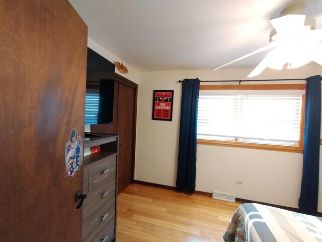 1173 Lucas St, Calumet City, IL 60409 - bedroom featuring light wood finished floors, baseboards, and ceiling fan